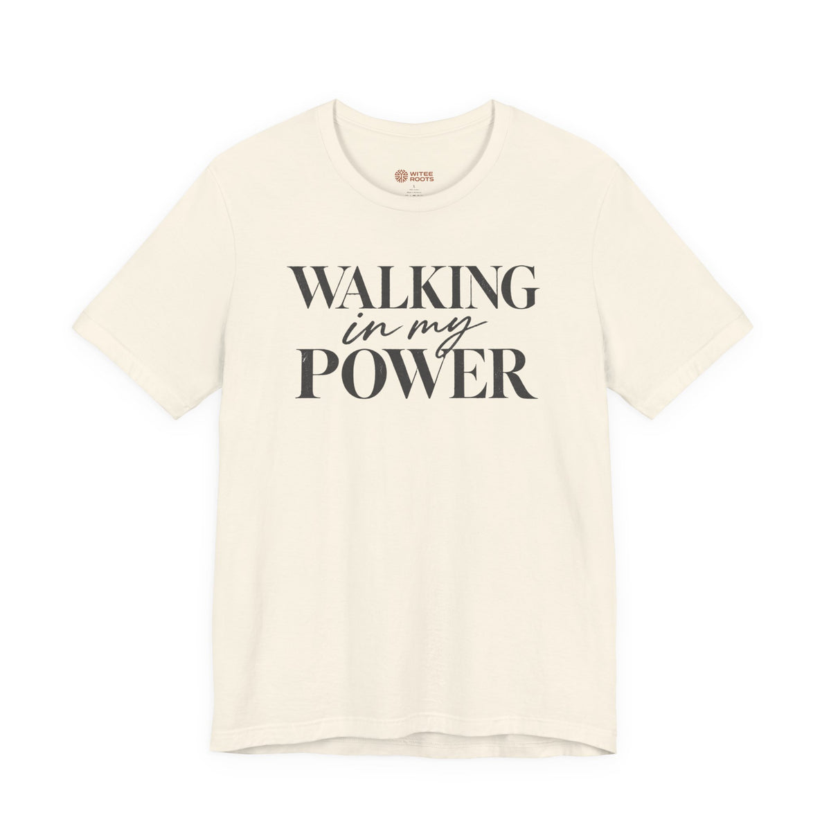 An off-white short-sleeve t-shirt with the text 'WALKING in my POWER' printed in dark gray on the front, displayed against a solid white background.