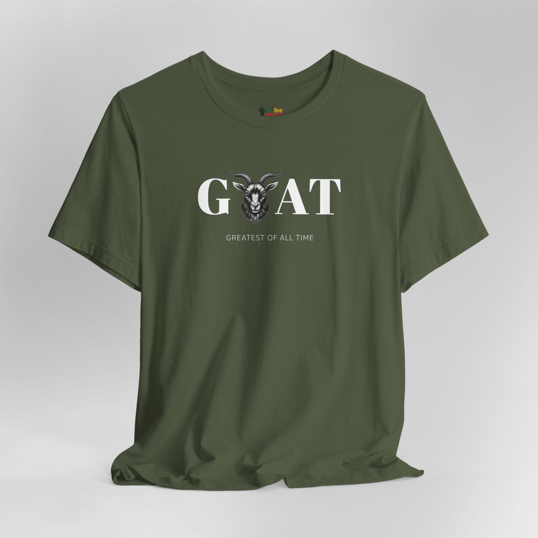 Green t-shirt with 'Greatest of All Time' text and goat graphic on a gray background