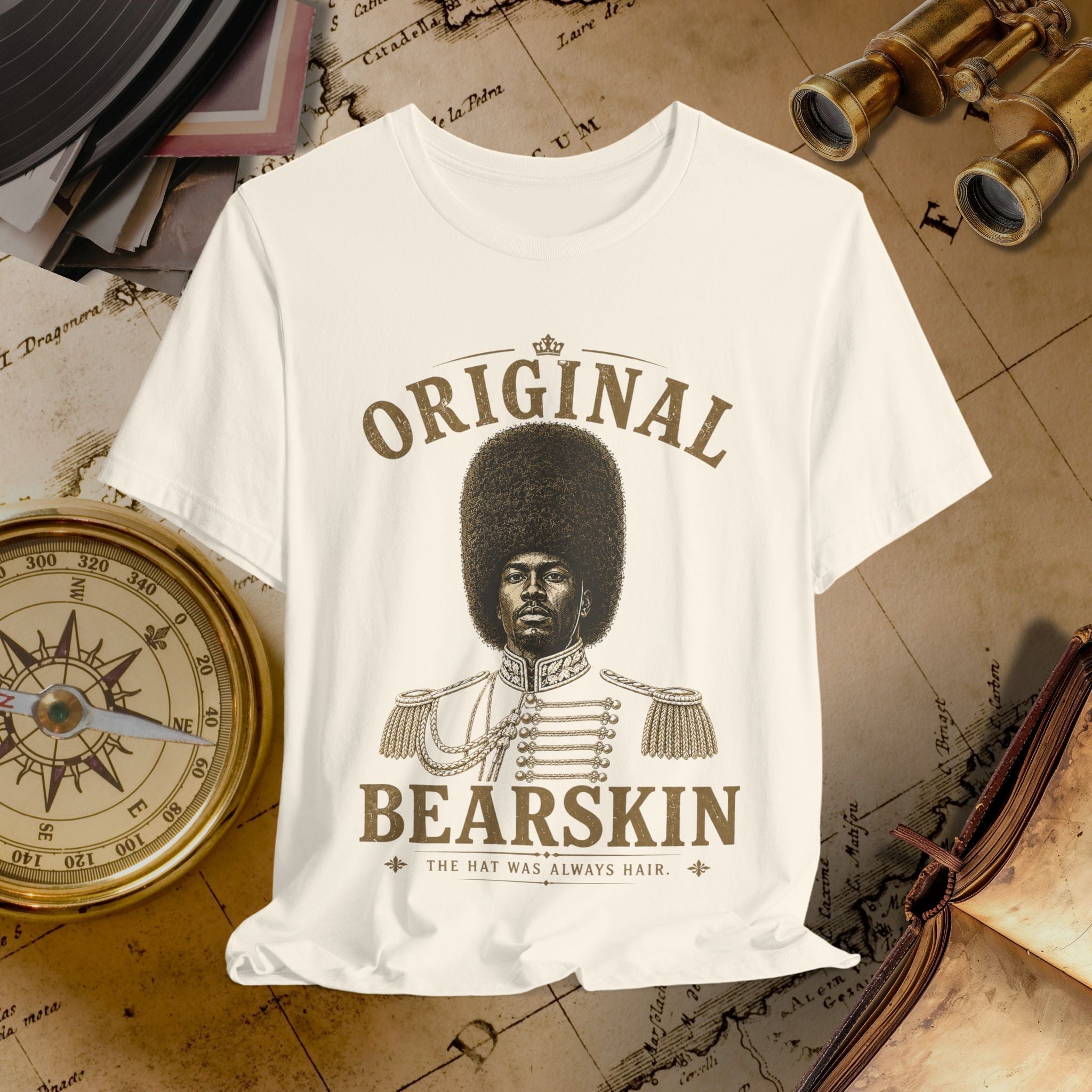 Beige t-shirt with a graphic of a man in uniform and text 'Original Bearskin' on a vintage background.