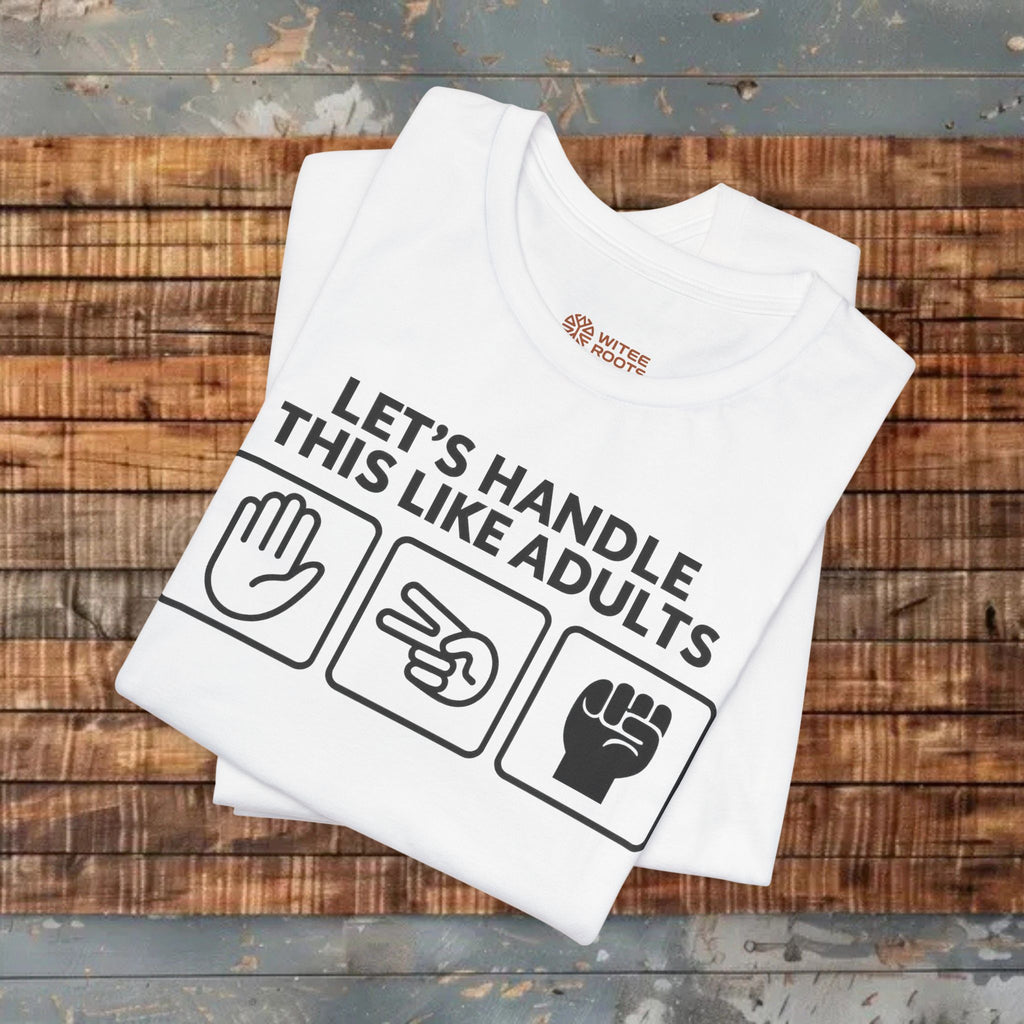 White t-shirt with text and graphics on a wooden surface