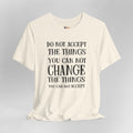 Beige t-shirt with motivational quote on a gray background
