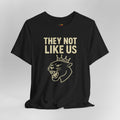 Black t-shirt with gold text and panther graphic on a gray background