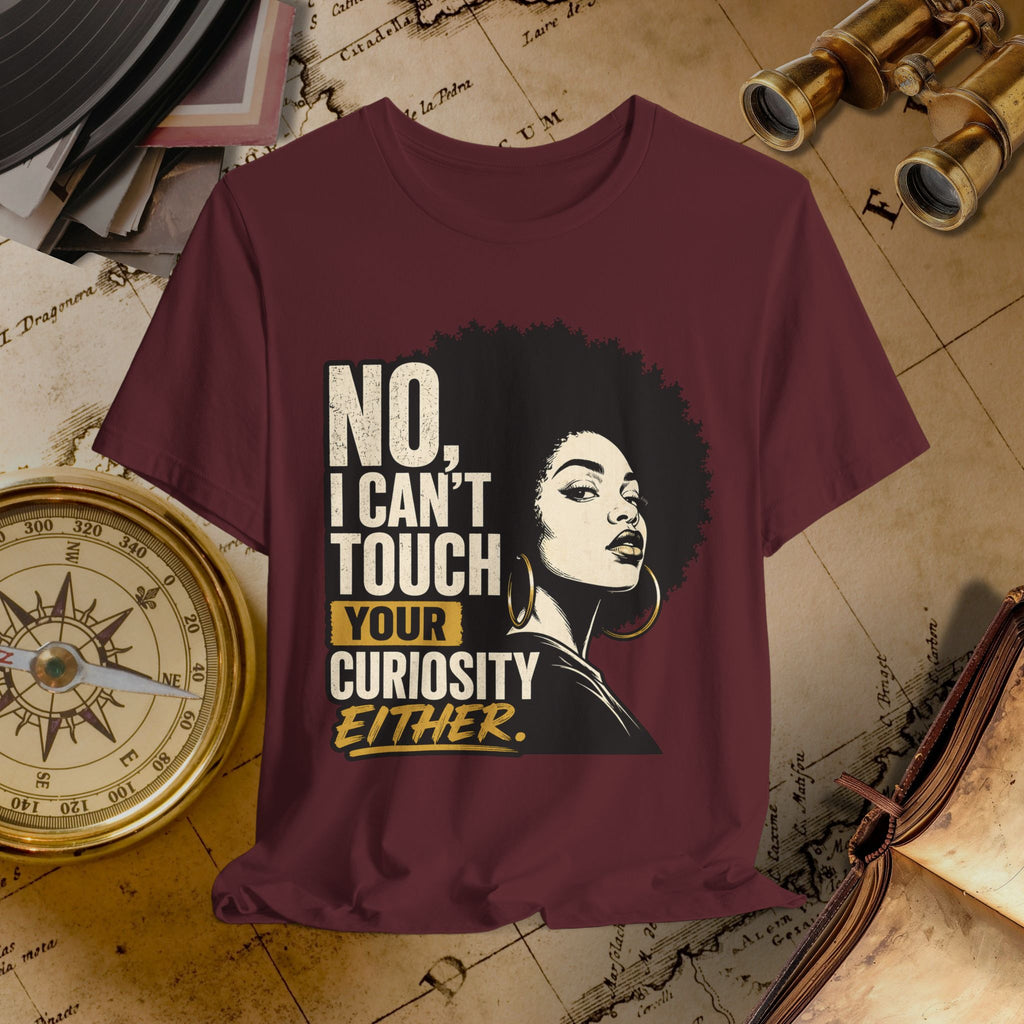 Maroon t-shirt with graphic and text on a vintage map background