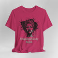 Pink t-shirt with a graphic of a woman's face and the text 'Unapologetically Regal' on a gray background