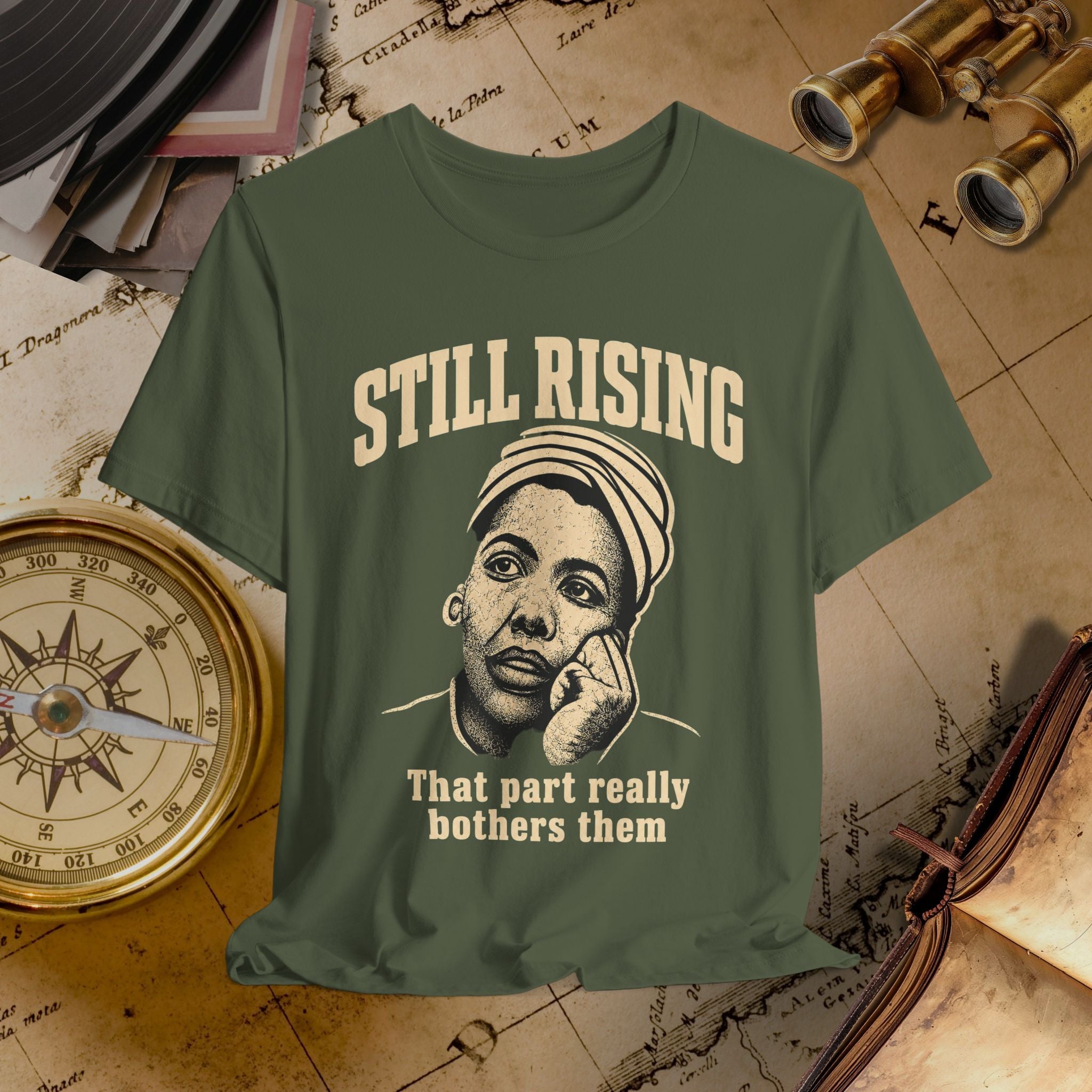 Green t-shirt with graphic and text on a vintage map background