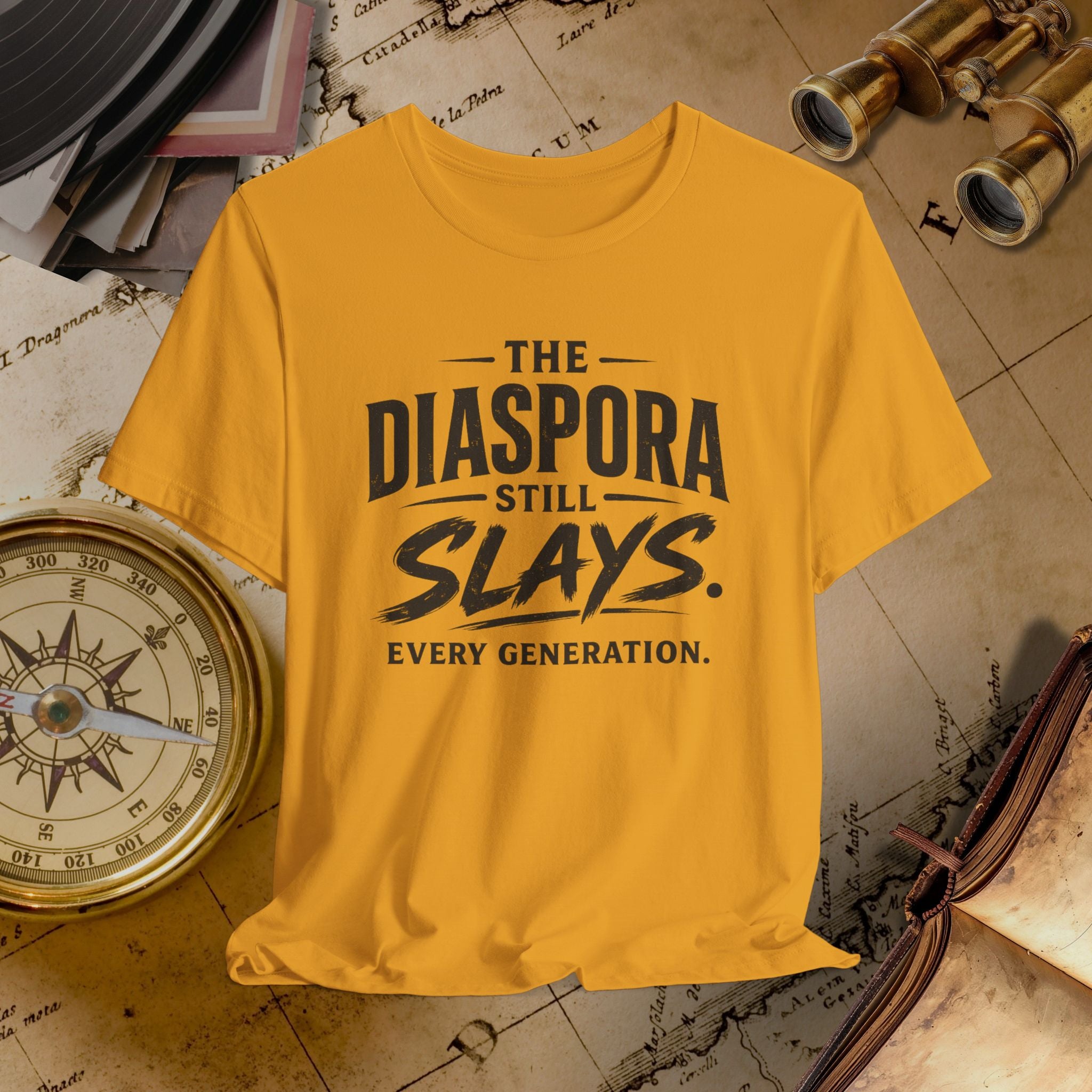 Mustard t-shirt with 'The Diaspora Still Slays Every Generation' text on a vintage map background.