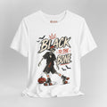 A white short-sleeve graphic T-shirt on a light gray background. The shirt features a large front print with the words 'BLACK TO THE BONE' in a distressed brush font, a crowned black-and-white skeleton roller skate, a jack-o'-lantern, and small black bats.