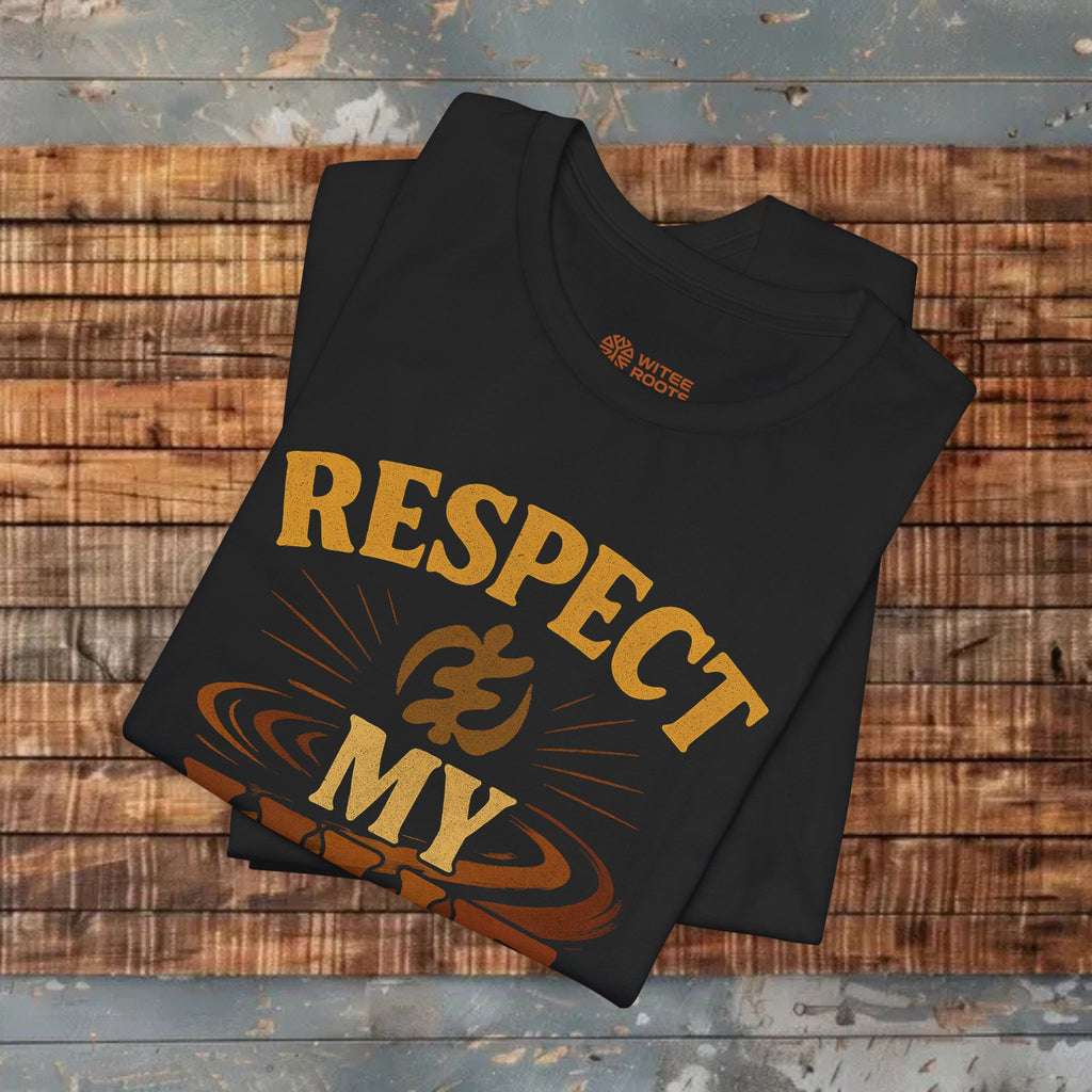 Black t-shirt with 'RESPECT MY' text on a wooden surface