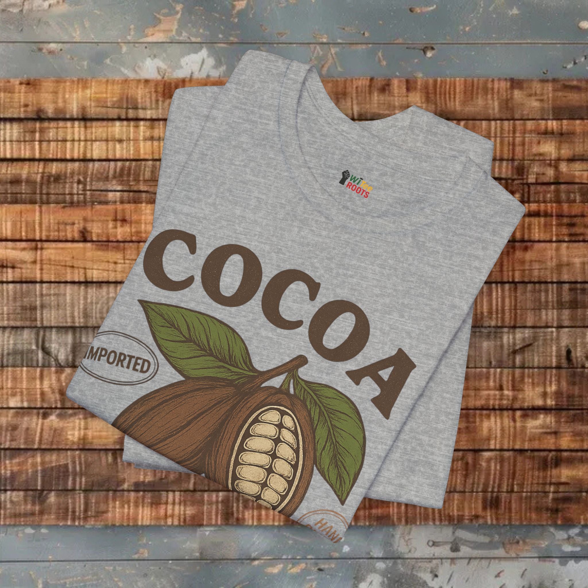 Gray t-shirt with cocoa design and 'Imported' text on a wooden surface