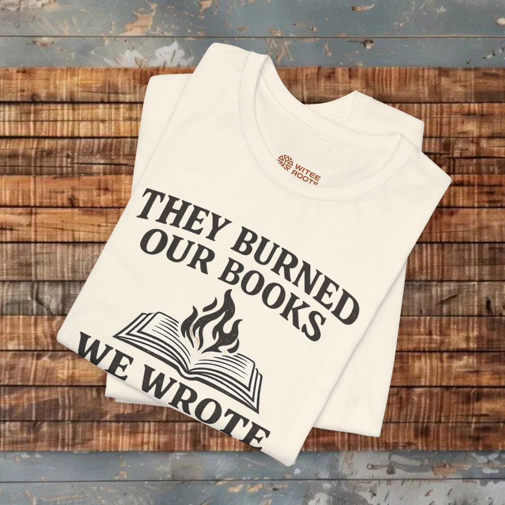 Beige t-shirt with printed text and logo on a wooden surface