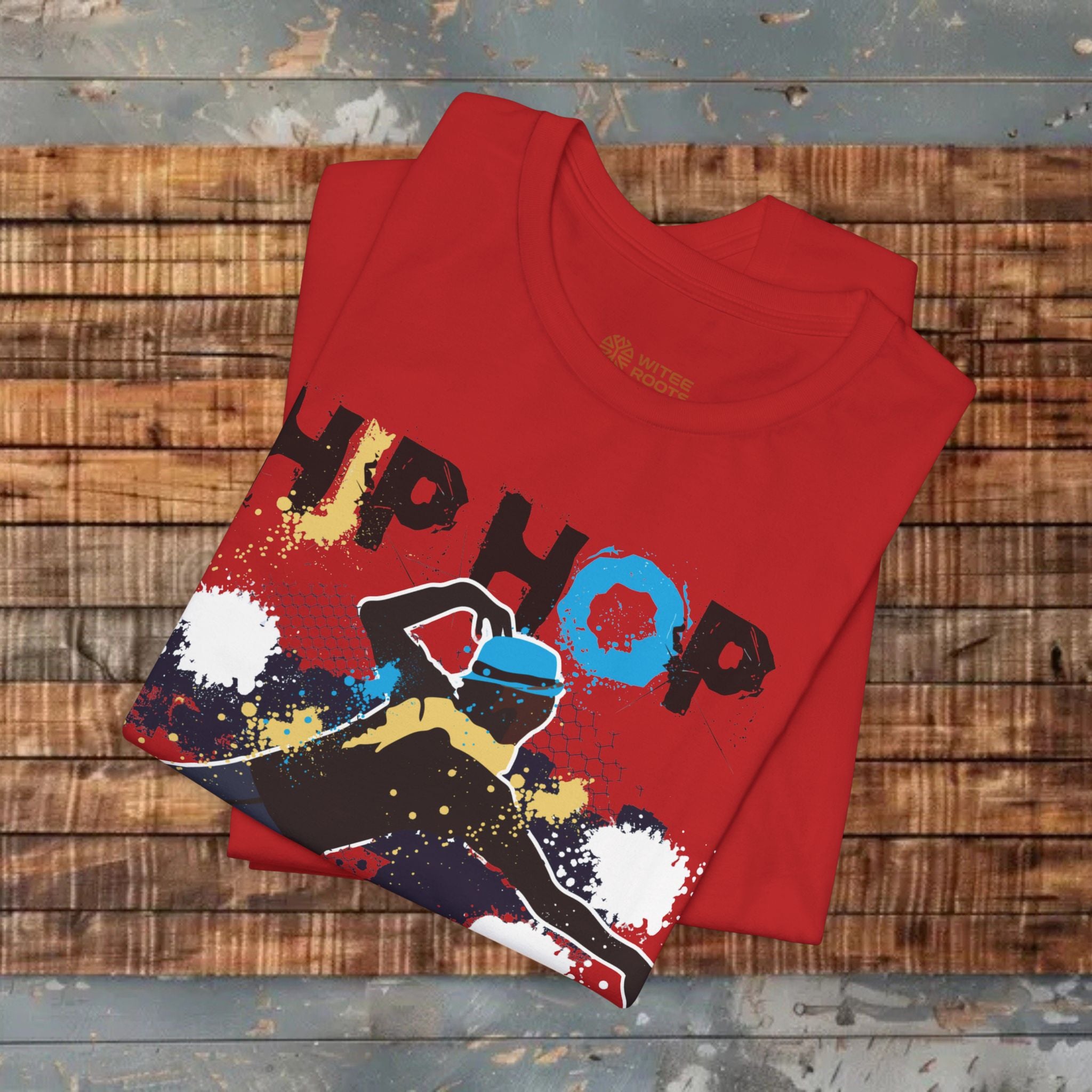 Red T-shirt folded on wooden floor