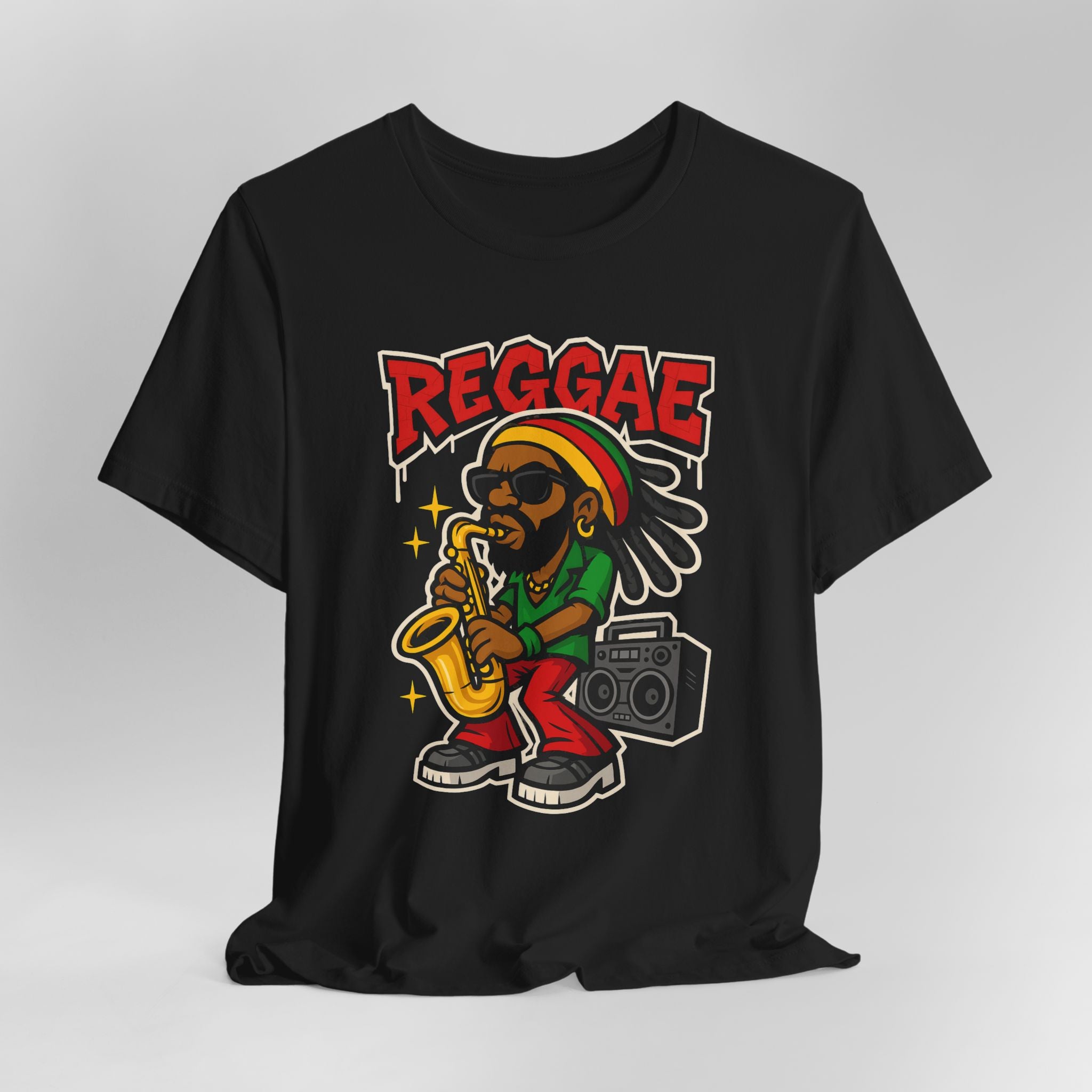 Black t-shirt with a colorful graphic of a person playing a saxophone and holding a boombox, with 'REGGAE' text above.