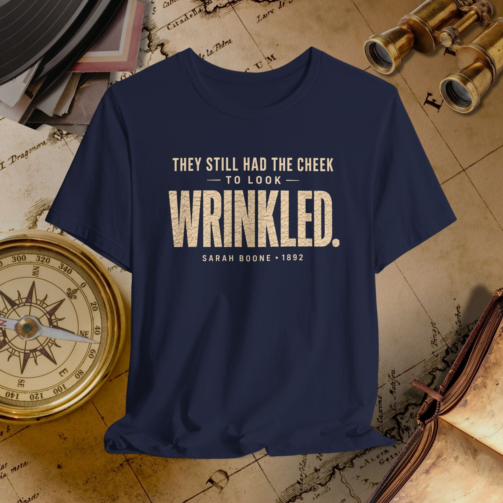 Navy blue t-shirt with humorous quote on a vintage map background