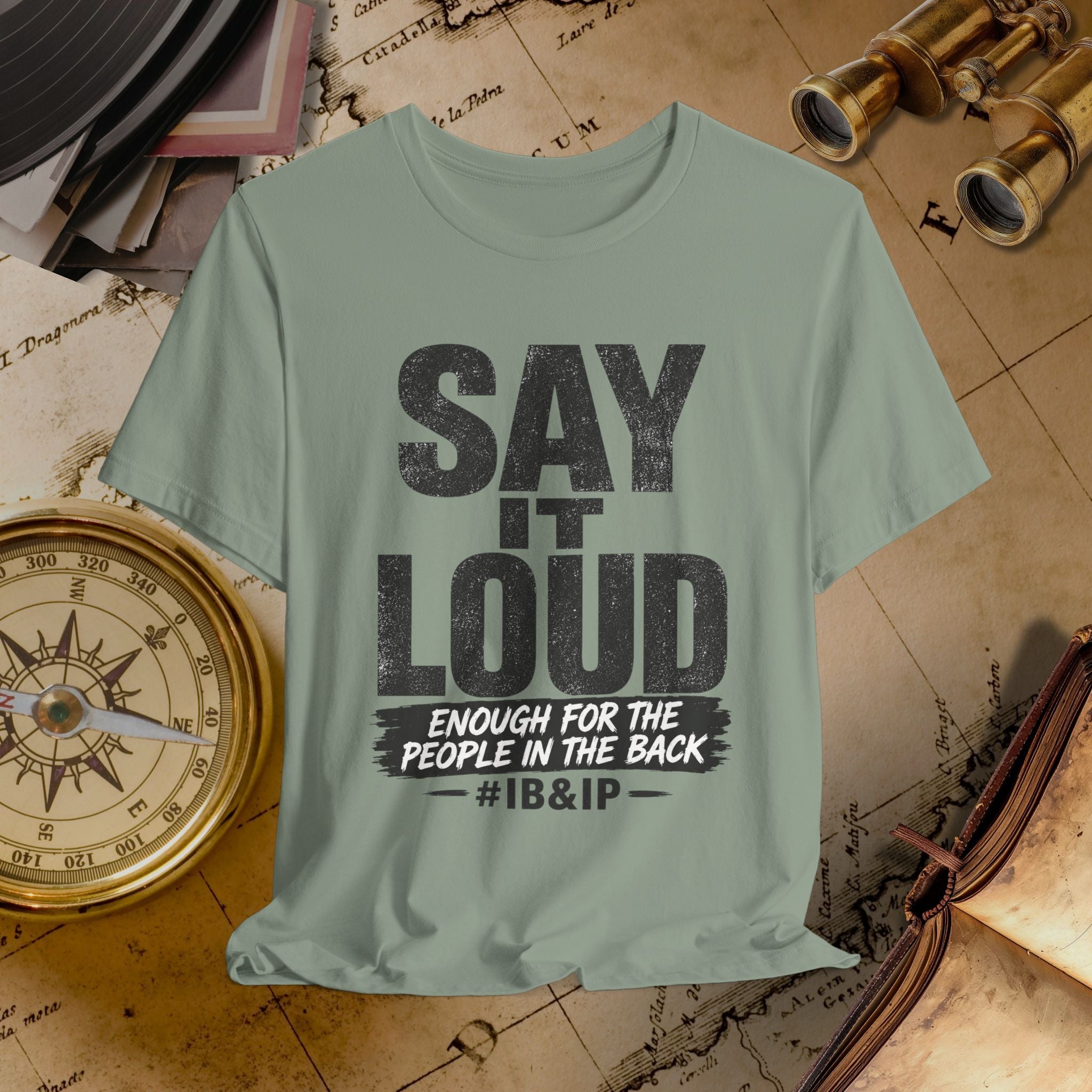 Light green t-shirt with text on a vintage map background