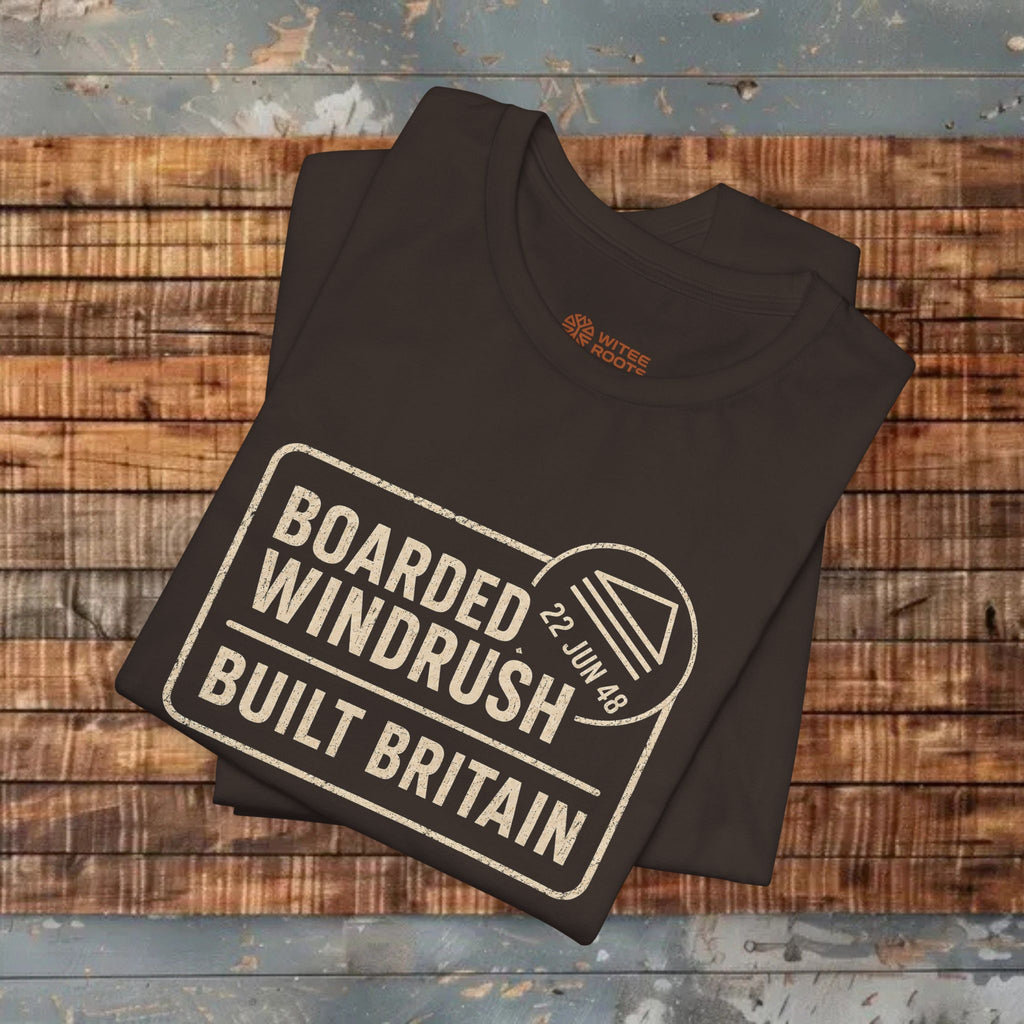 Folded brown t-shirt with text design on a wooden surface