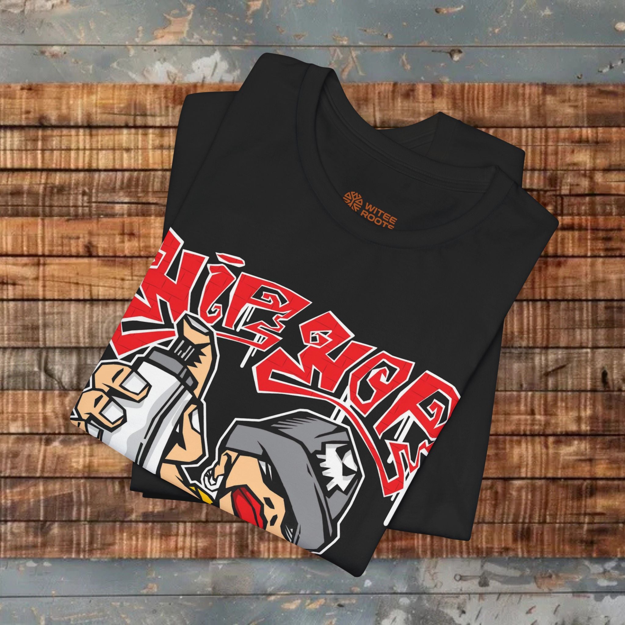 Black t-shirt with graphic design on a wooden surface