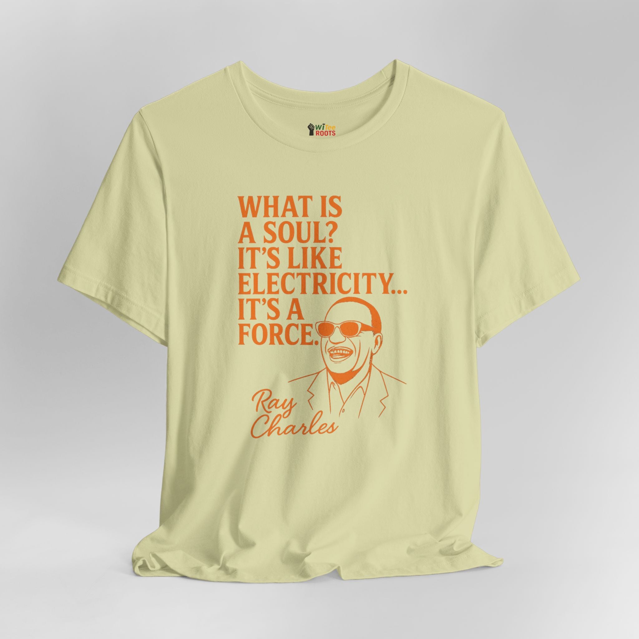 Green t-shirt with orange text and Ray Charles illustration on a gray background