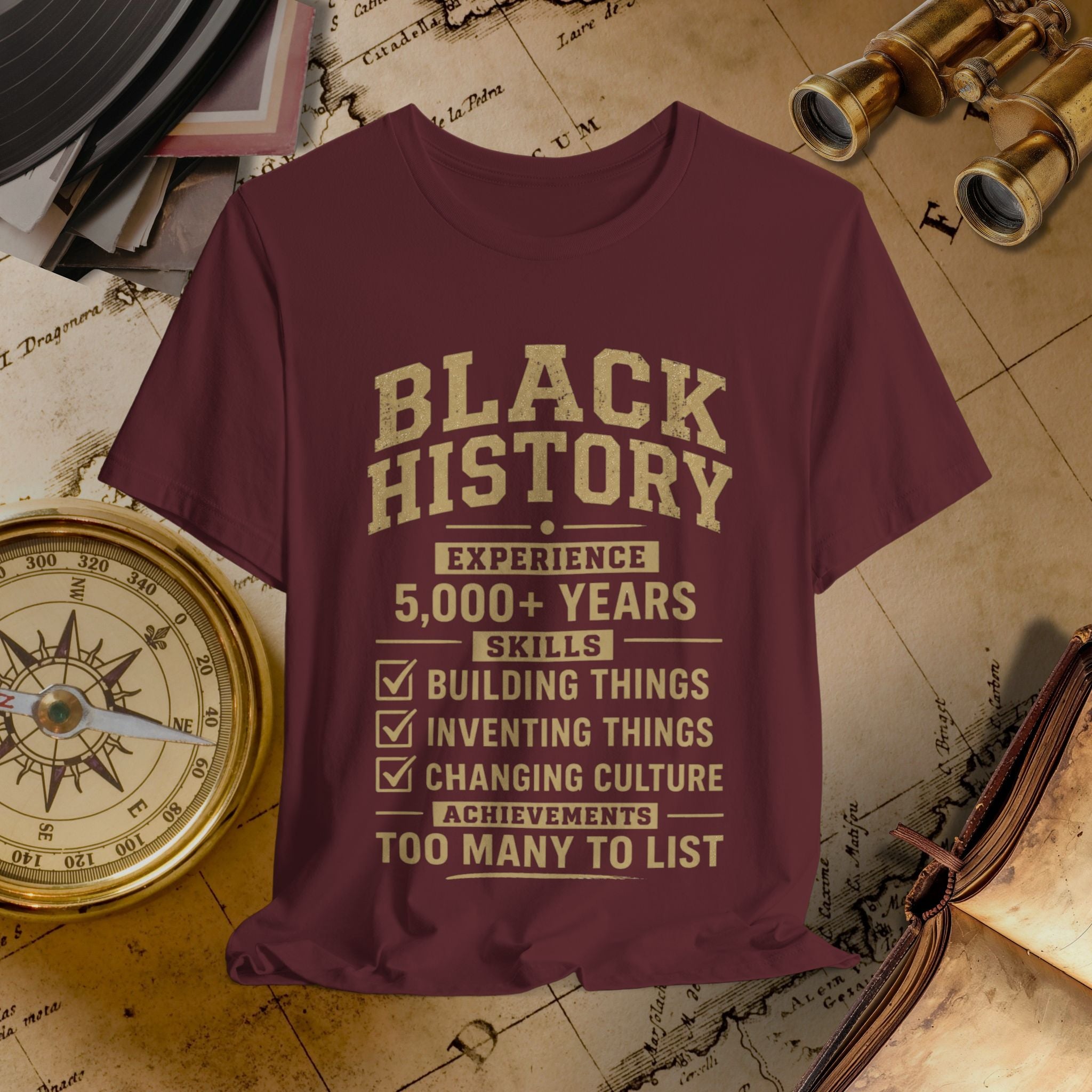 Maroon t-shirt with 'Black History' text on a vintage map background