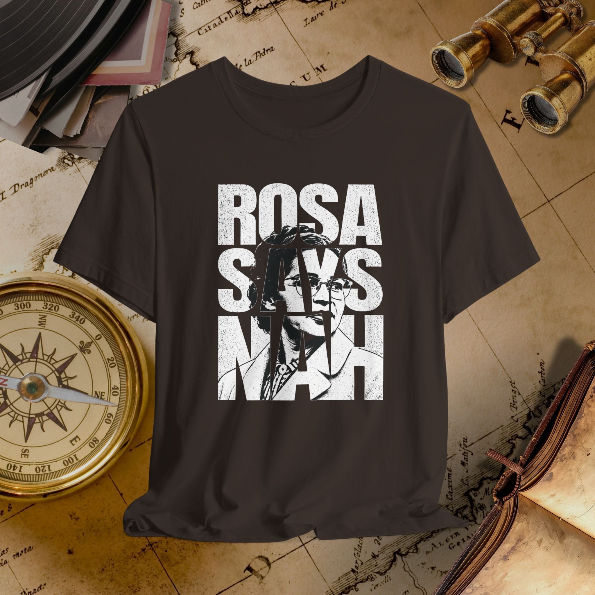 Brown t-shirt with 'ROSA SAYS NAAH' graphic on a vintage map background