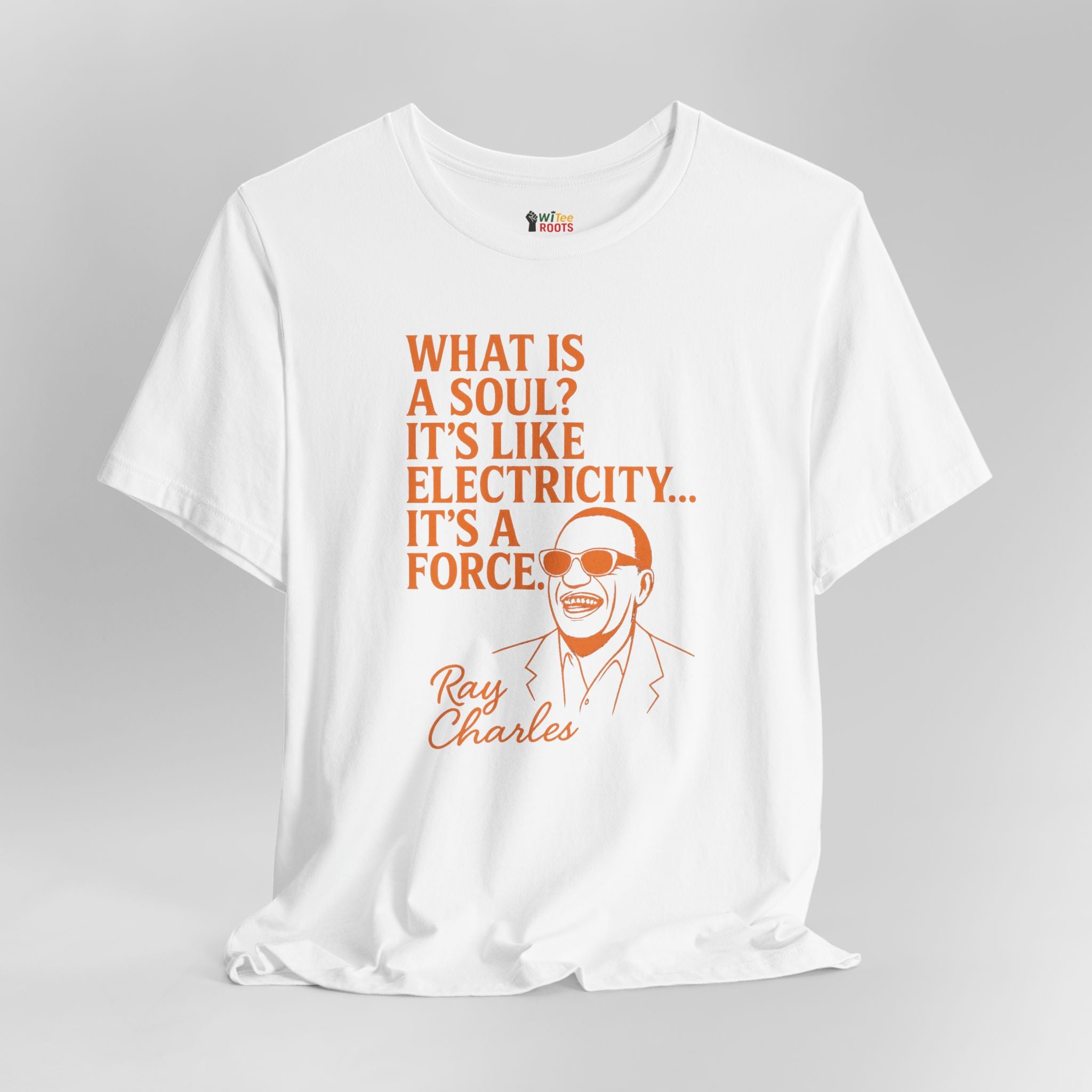 White t-shirt with orange text and graphic of Ray Charles on a gray background