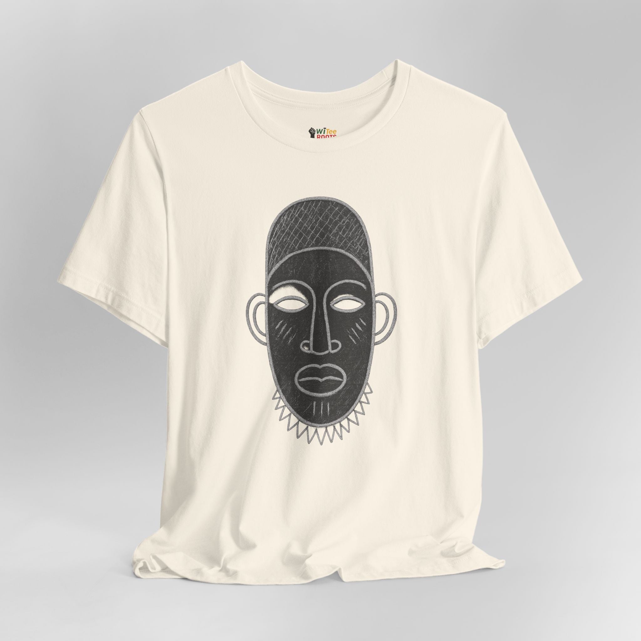 Cream t-shirt with black mask design on a gray background