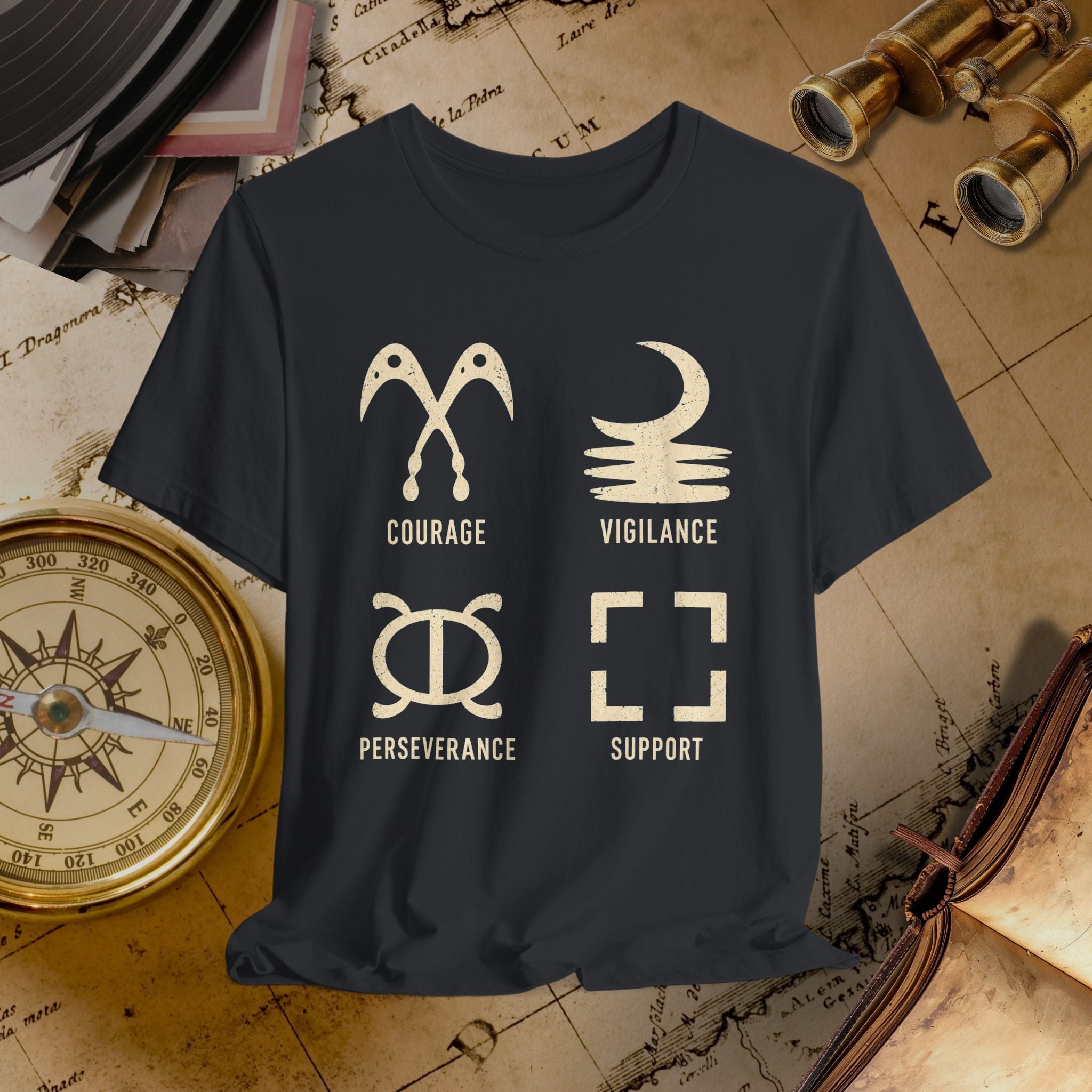 Black t-shirt with white symbols and text on a vintage map background