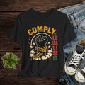 Black t-shirt with graphic design featuring a fist and text on a wooden surface with jeans and sneakers.