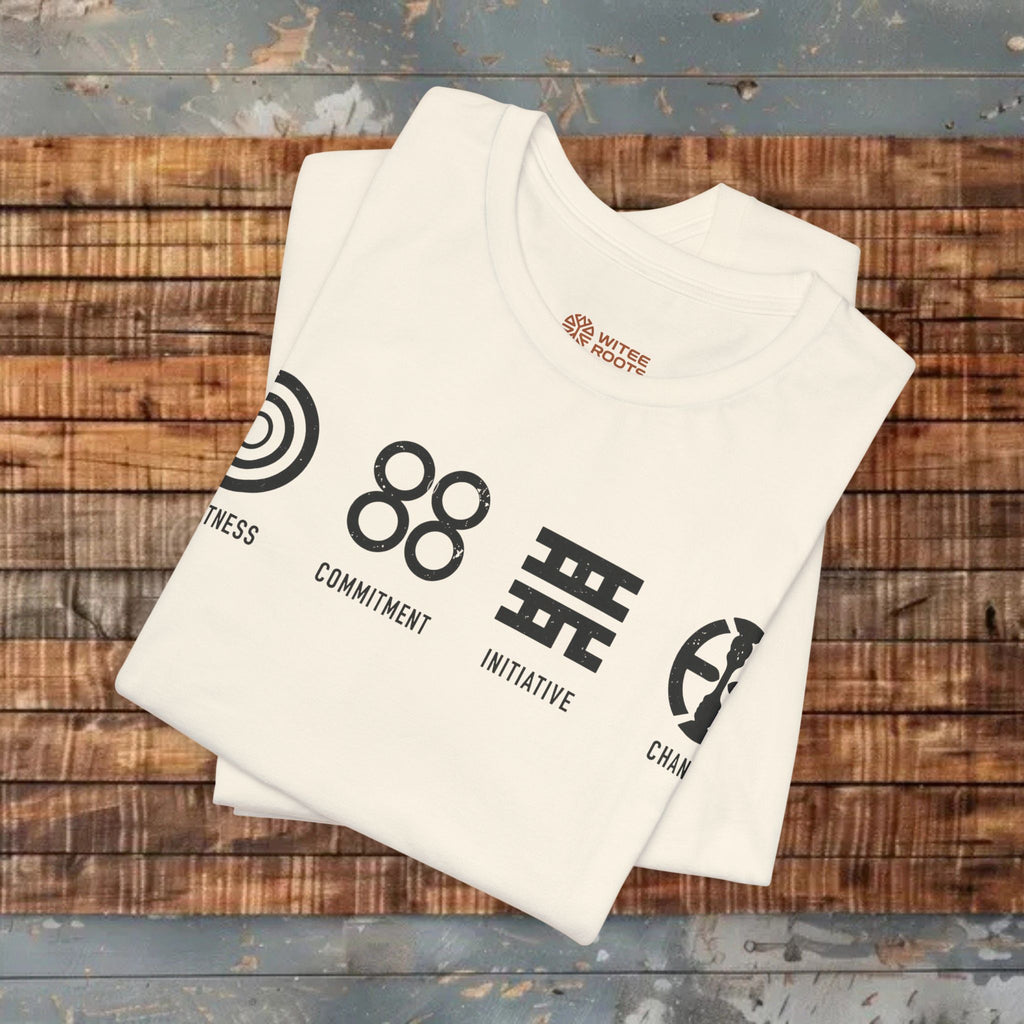 White t-shirt with black graphics and text on a wooden surface