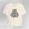 Cream t-shirt with black text 'I LIKE FRIED CHICKEN AND MAYBE 3 PEOPLE' on a gray background