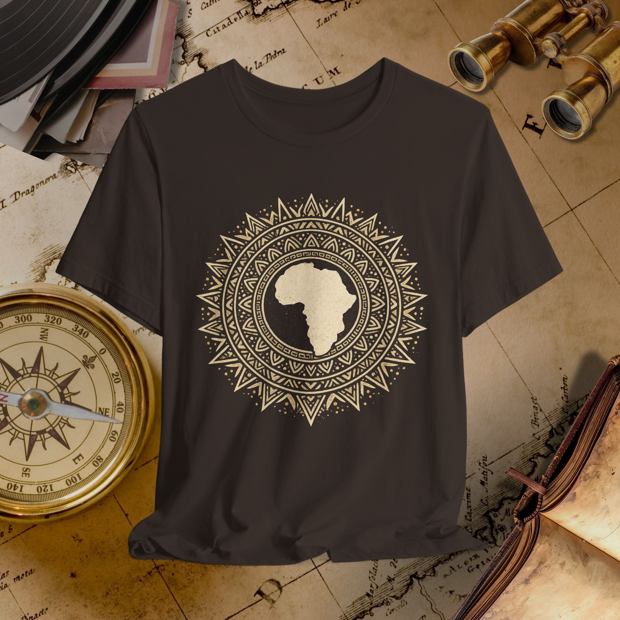 Brown t-shirt with a decorative African design on a vintage map background