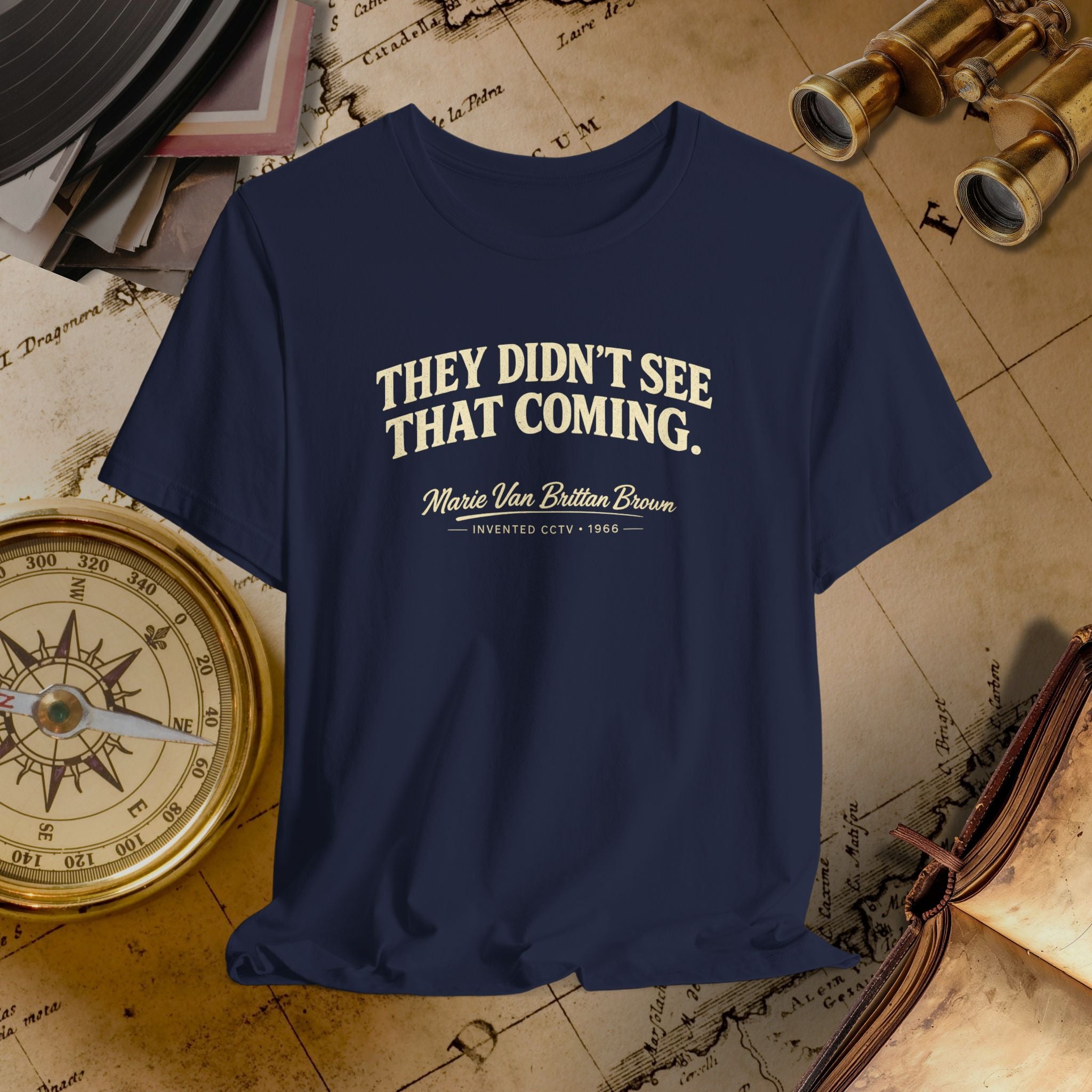 Navy blue t-shirt with white text on a vintage map background