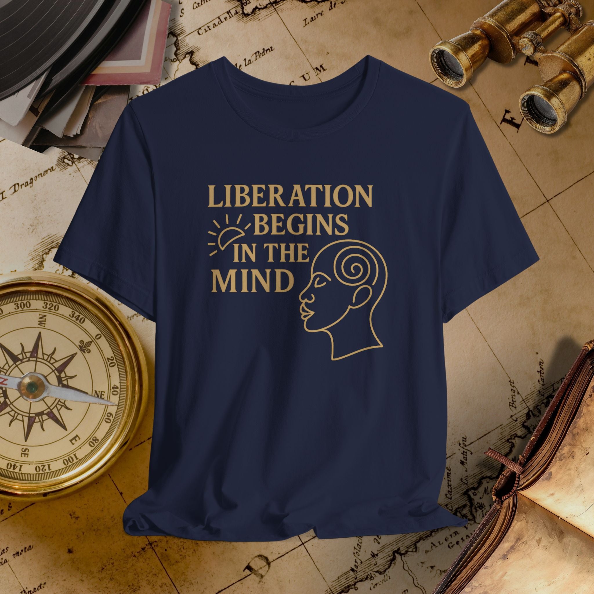 Navy blue t-shirt with 'Liberation Begins in the Mind' text and graphic on a vintage map background.