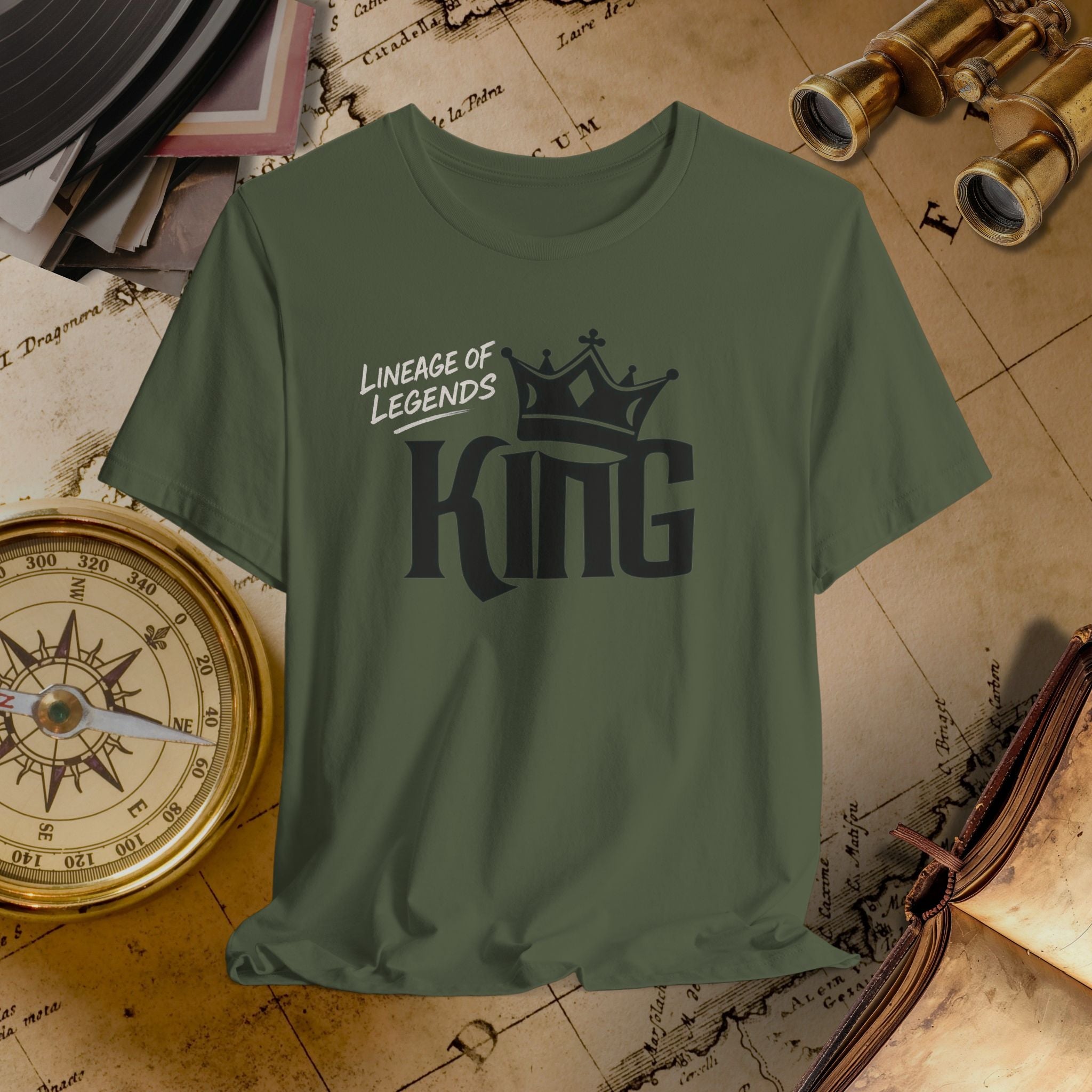 Green t-shirt with 'King' design on a vintage map background