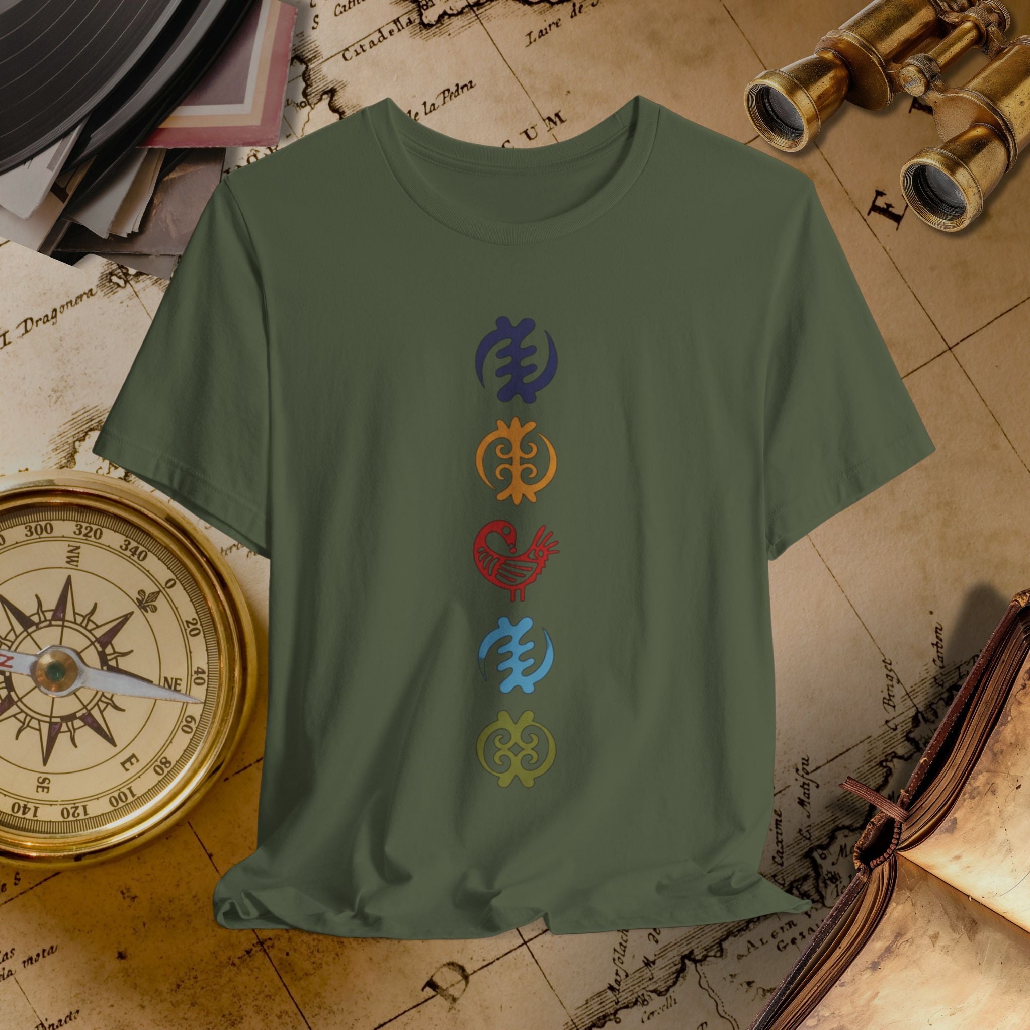 Green t-shirt with colorful symbols on a vintage map background