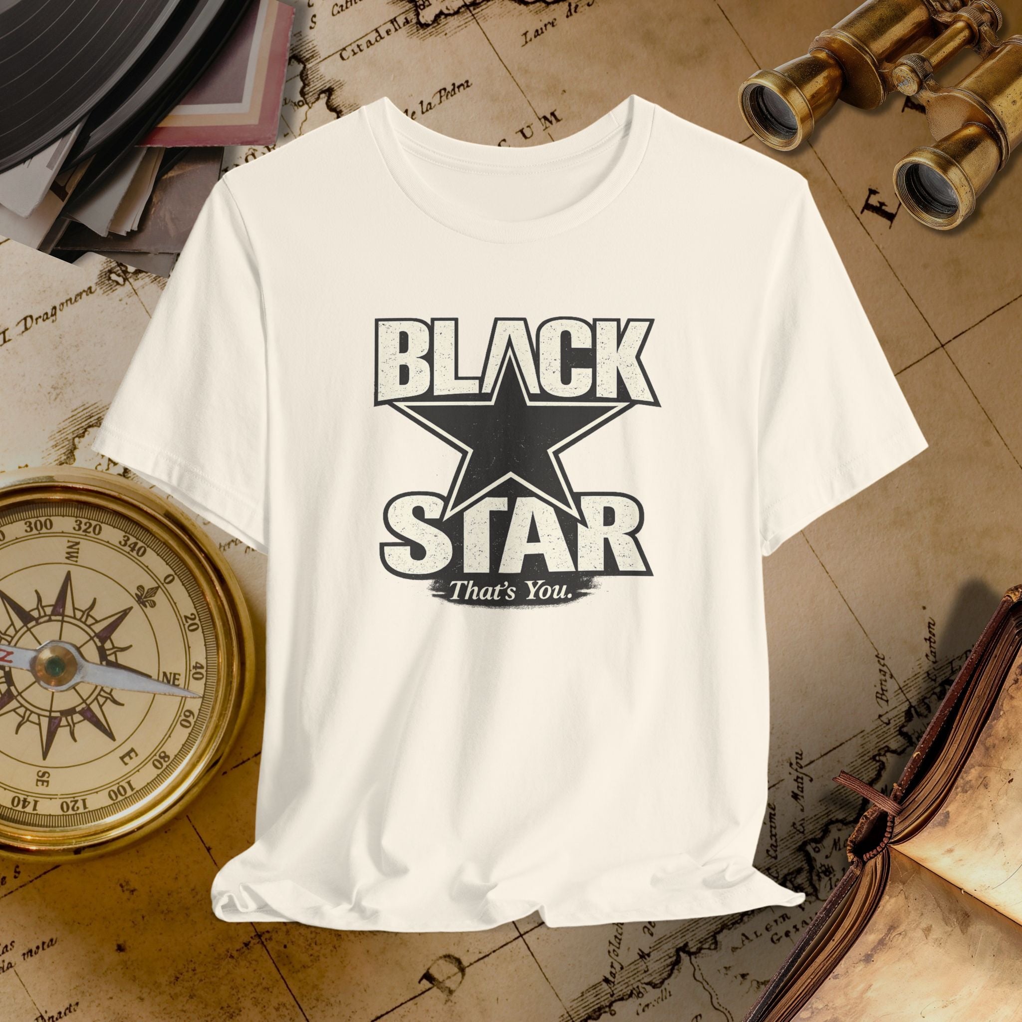 White t-shirt with 'Black Star That's You' design on a vintage map background