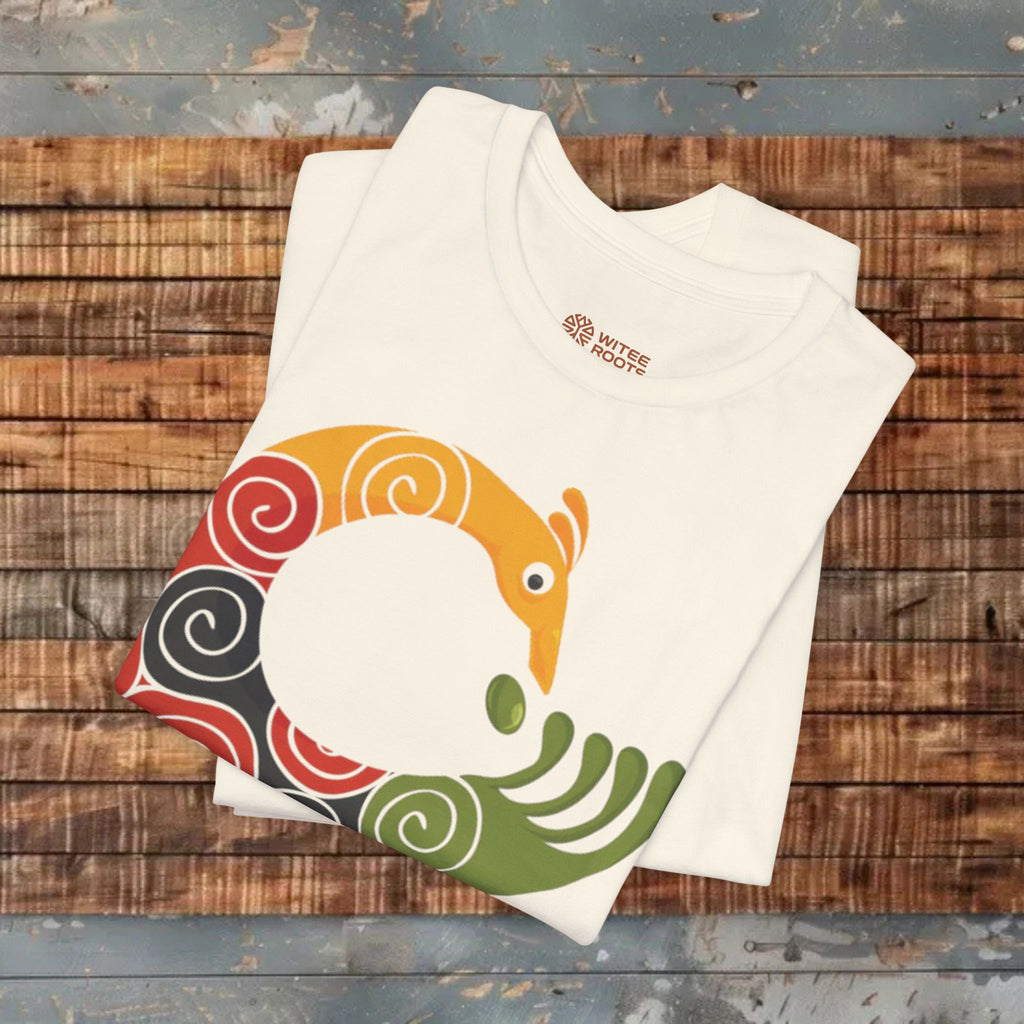 Beige t-shirt with colorful graphic design on a wooden surface