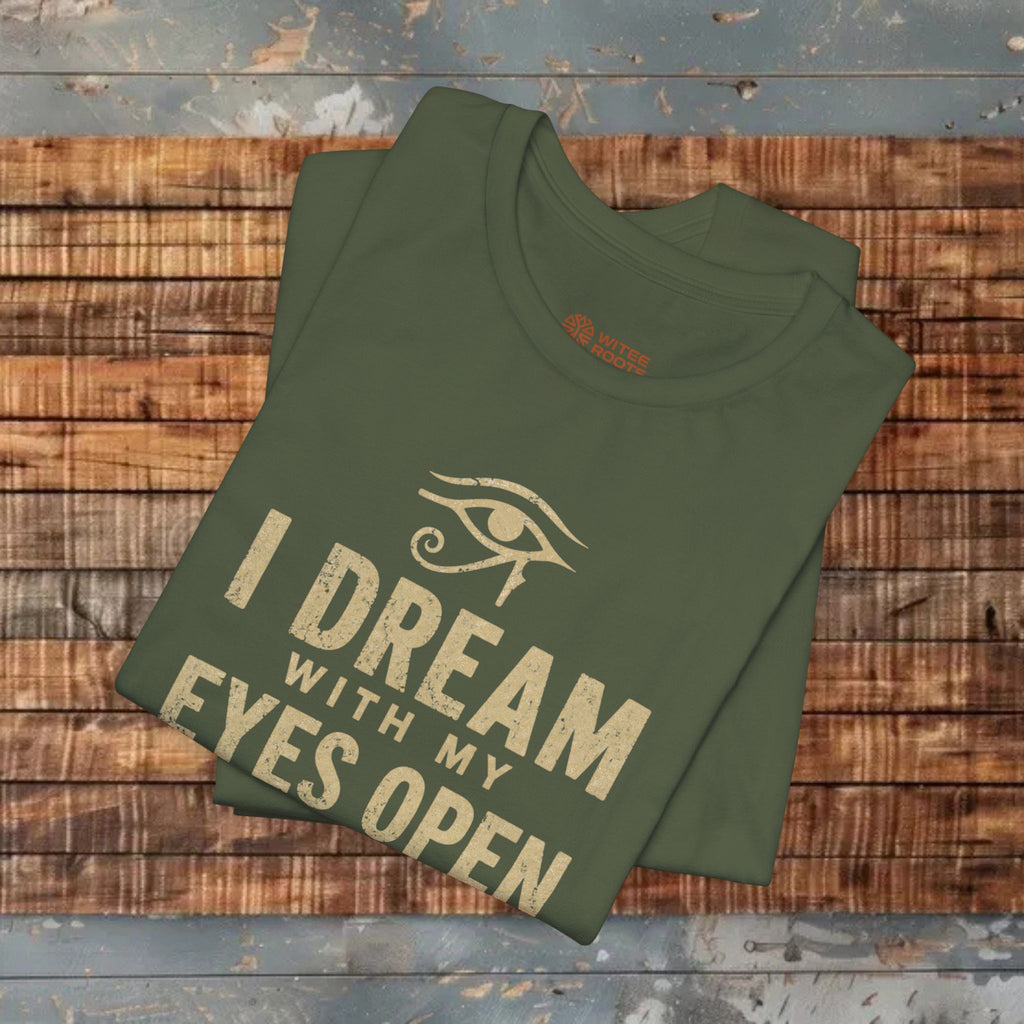 Green t-shirt with text and eye graphic on a wooden surface