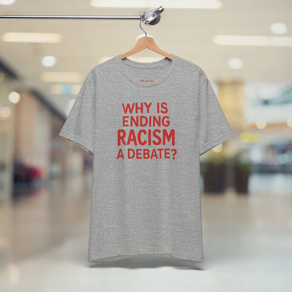 Gray t-shirt with red text on a hanger in a store setting