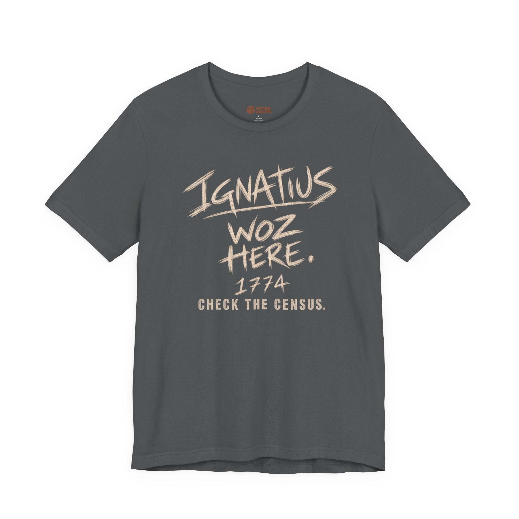A dark gray crewneck t-shirt with a distressed beige graphic print on the front reading 'IGNATIUS WOZ HERE. 1974 CHECK THE CENSUS.