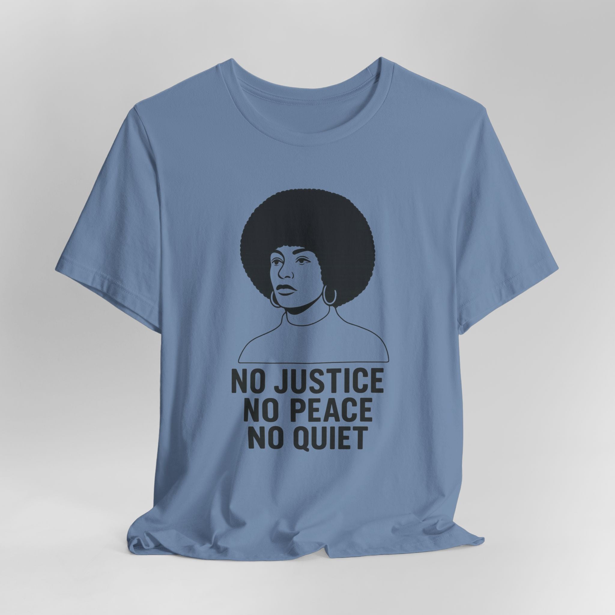 Blue t-shirt with a graphic of a woman with an afro and text 'No Justice No Peace No Quiet' on a gray background