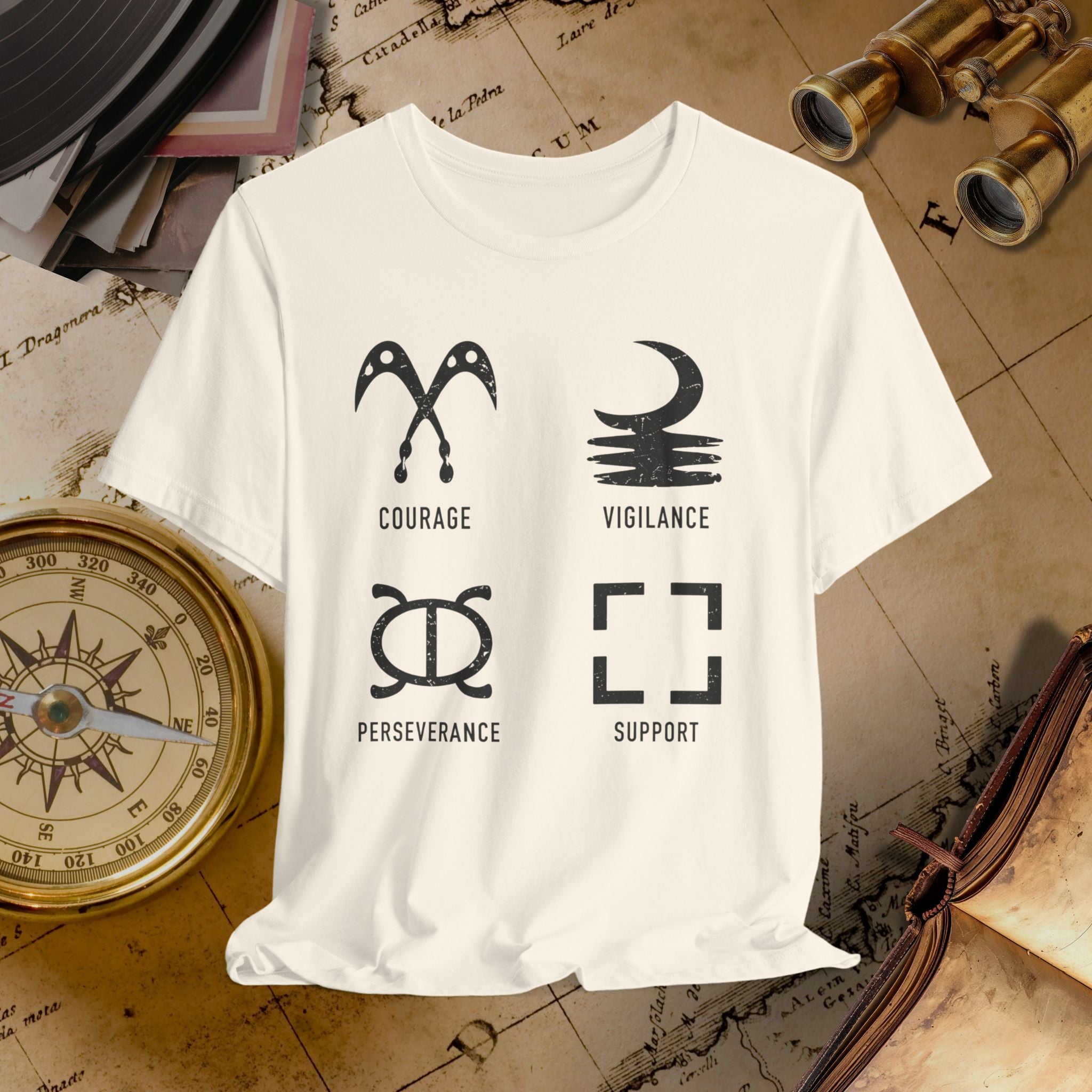 Sand t-shirt with black symbols and text on a vintage map background