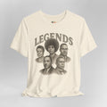 Beige t-shirt with black and white graphic of five individuals and 'LEGENDS' text on a gray background