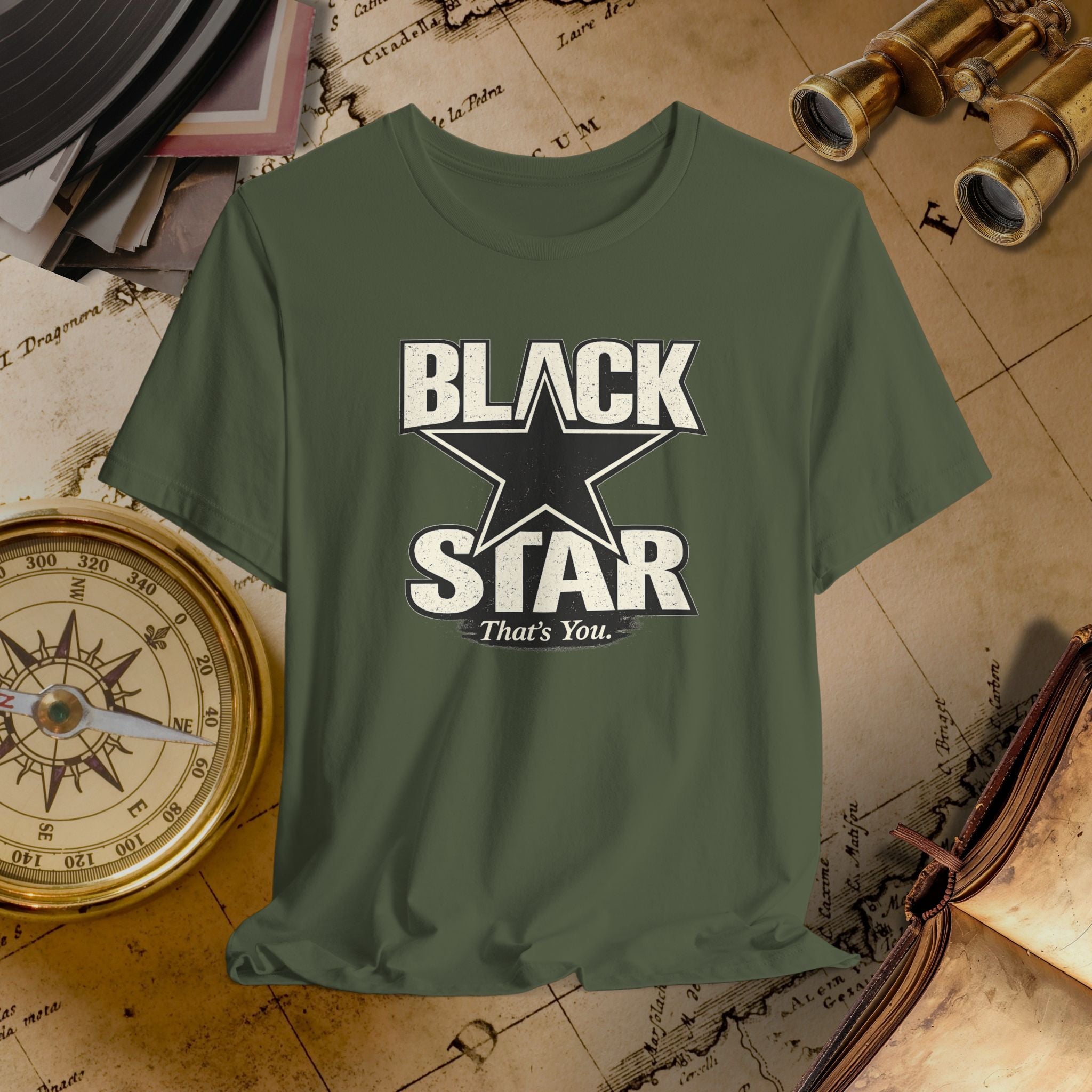 Green t-shirt with 'Black Star That's You' design on a vintage map background