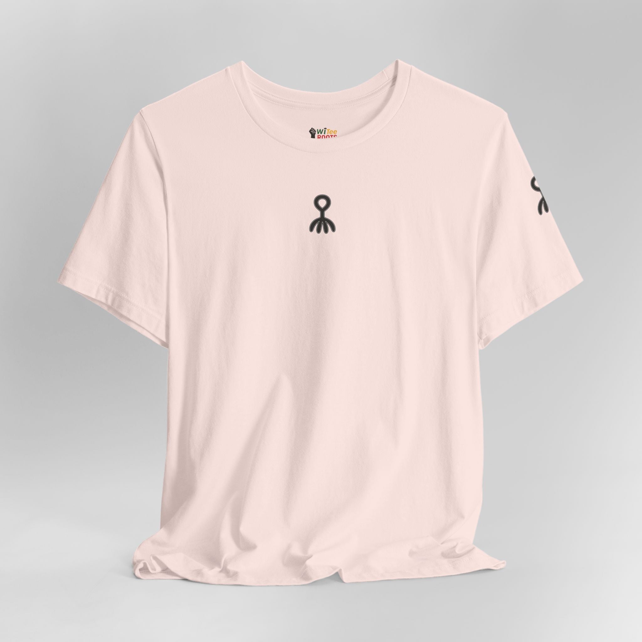Pink t-shirt with black graphics on a gray background
