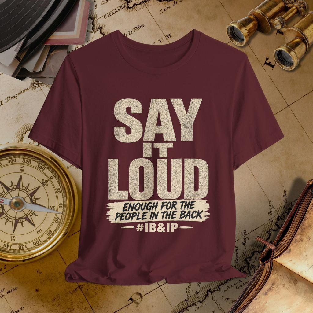 Maroon t-shirt with 'Say it Loud' text on a vintage map background