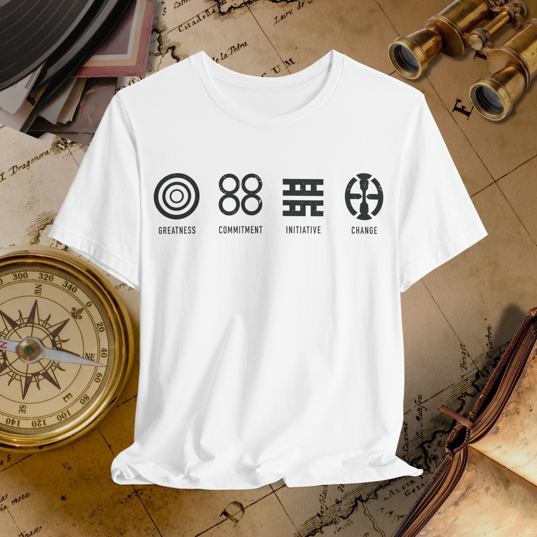 White t-shirt with symbols and text on a vintage map background