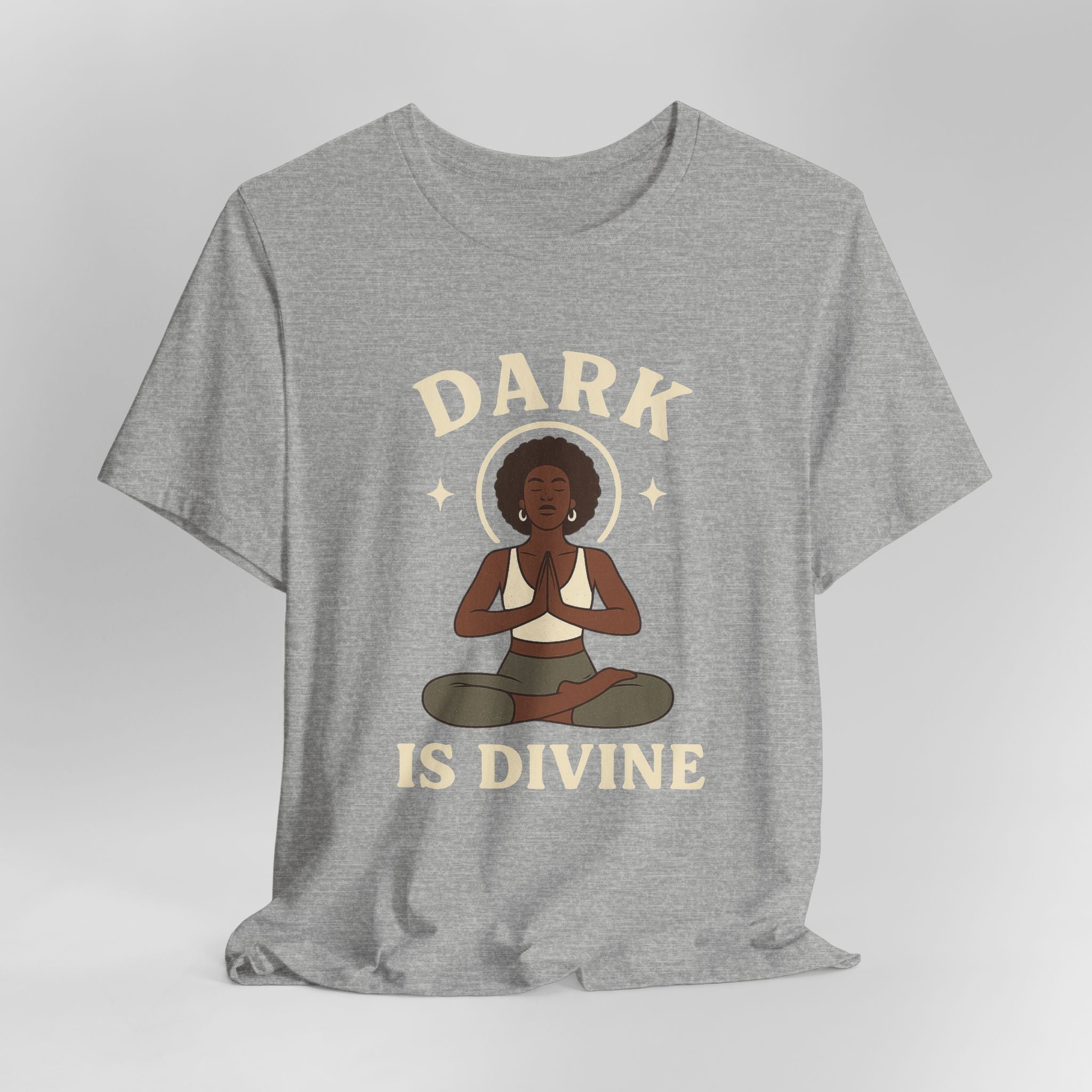 Gray t-shirt with a graphic of a woman in a yoga pose and 'Dark is Divine' text on a light gray background
