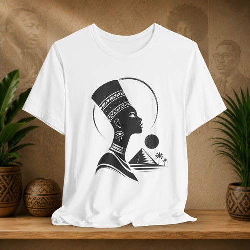 White t-shirt with a black silhouette design of a woman on a wooden shelf with plants and decorative items.