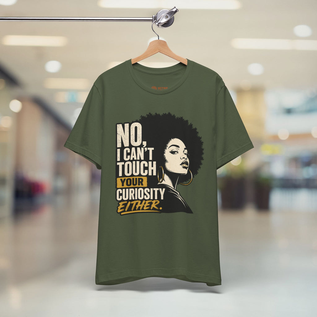 Green t-shirt with graphic and text on a hanger in a store setting