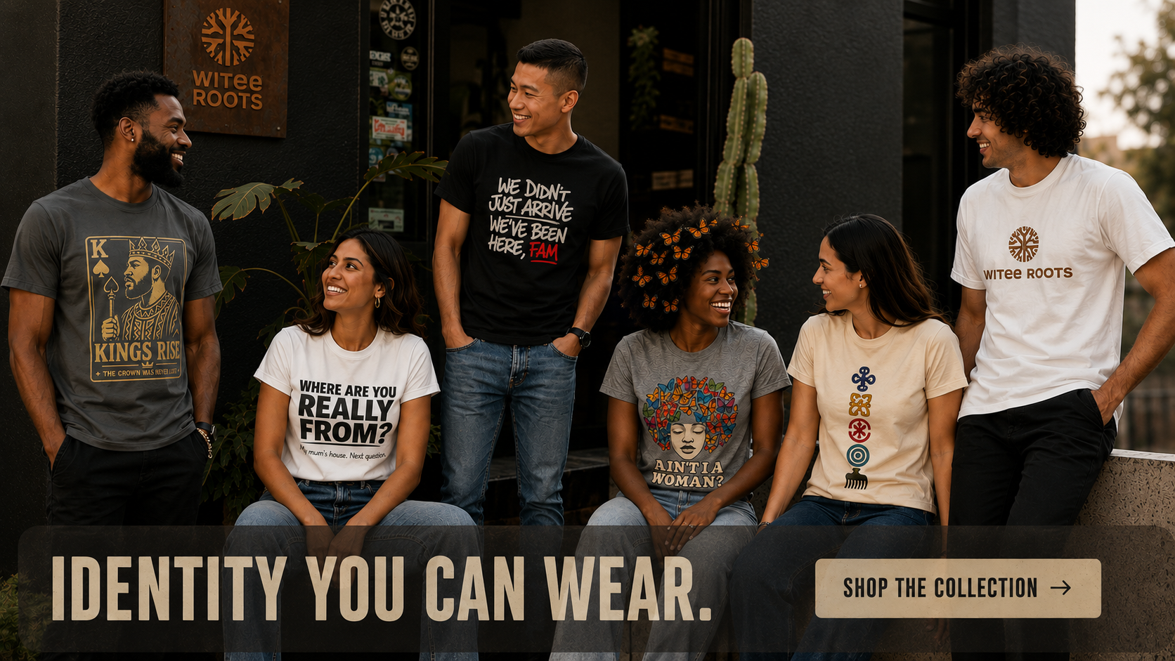 Five people standing and sitting outdoors in front of a storefront, each wearing a different printed T-shirt. Visible shirts include gray, black, white, and beige designs with text and graphics such as 'Kings Rise,' 'We Don't Just Agree We've Been Here Together,' 'Where Are You Really From?,' 'Kings Is A Woman,' and 'WATER ROOTS.
